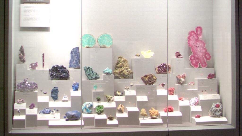 Case MC03, or the “Rainbow case,” in the Janet Annenberg Hooker Hall of Geology, Gems, and Minerals at the National Museum of Natural History (Credit: Svea Lin Rodgers, NMNH) Rainbow gems and minerals NMNH